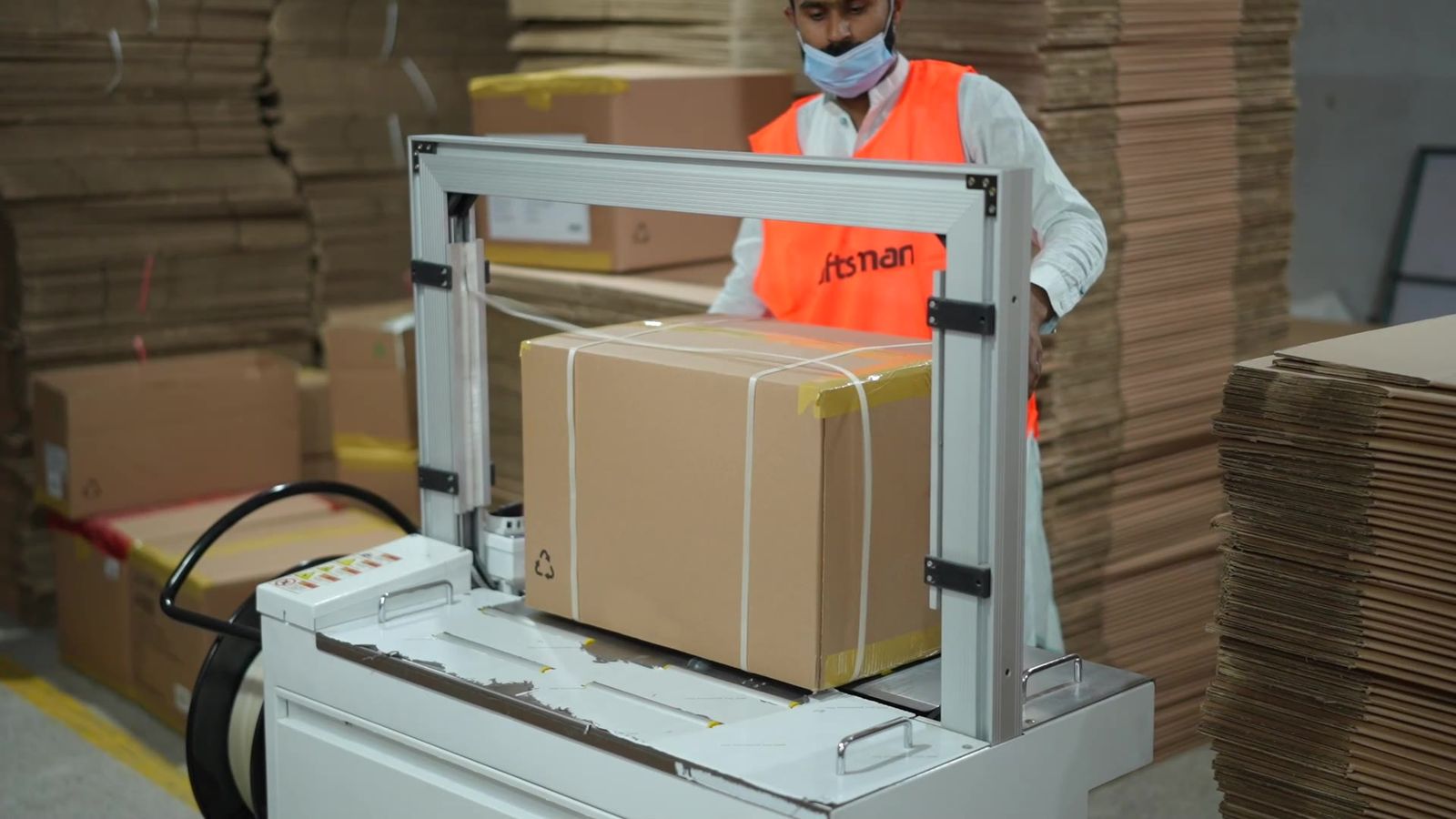 Automatic carton strapping